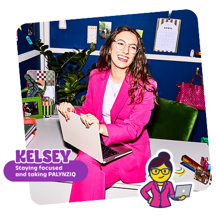 Kelsey focused sat with laptop